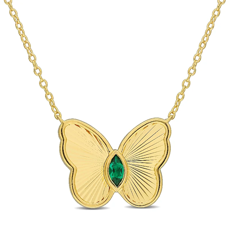 Sleek pendant necklaces-Miadora 1/5ct TGW Created Emerald Butterfly Necklace in Yellow Silver-17in